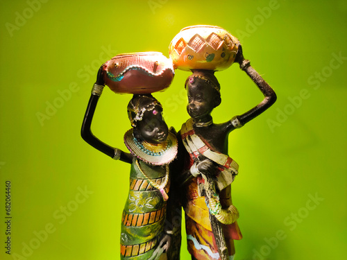 Handicrafted old adivasi couple Dolls in traditional style decorated in india. ethinic dress and culture of indian old culture is refected in the dolls. photo