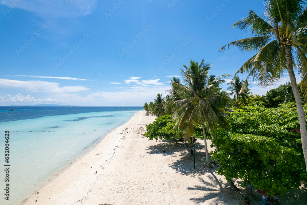 Aerial of Dumaluan Beach during a weekday in the island of Panglao, Philippines.