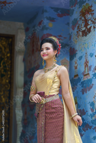 Beautiful Asian Thai girl portrait fashion of wearing an Elegant Thai dress wedding costume which is popular according to culture dress identity culture. Famous fashion Travel Thailand.