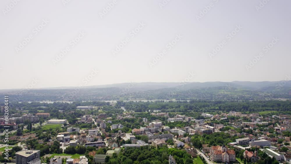 Drone flies from city Novi Sad towards mountain Fruska gora in Serbia in cloudy day Drone flies from city Novi Sad towards mountain Fruska gora in Serbia in cloudy day