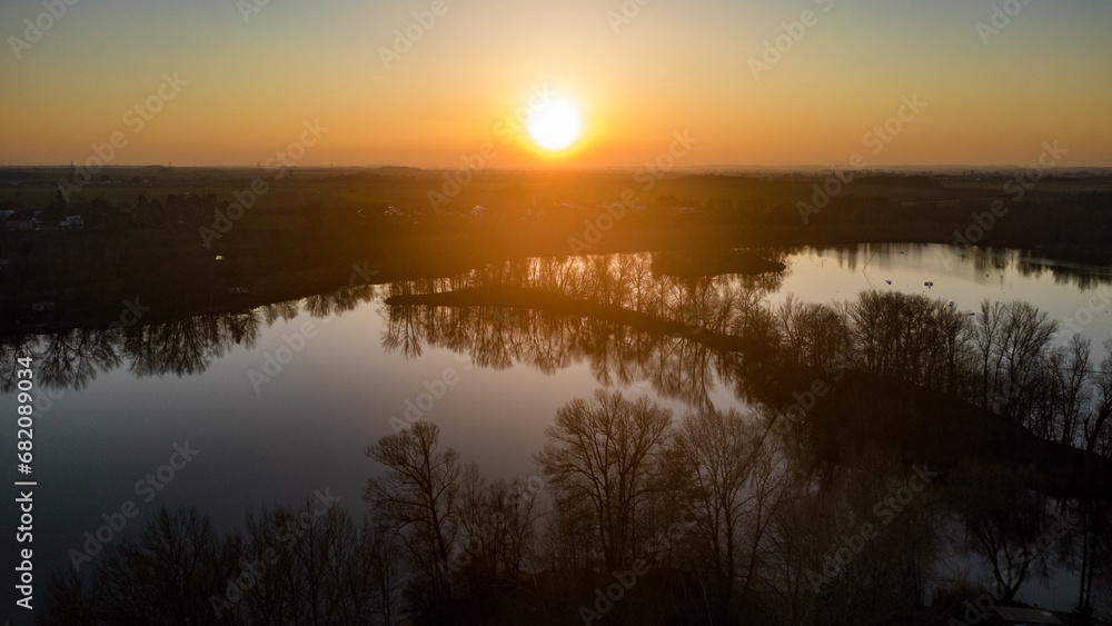 Sunset above river lagoon. Aerial drone view.
