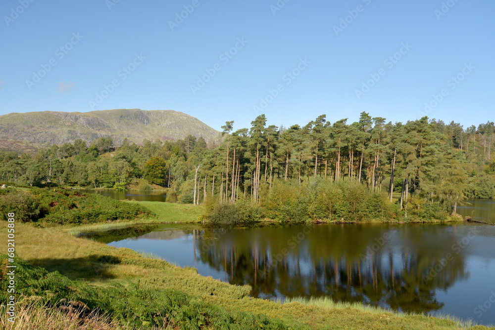 The peak of Wetherlam above the lakes at Tarn Hows in the Lake District