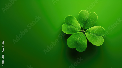 Four leaf clovers on a green background.