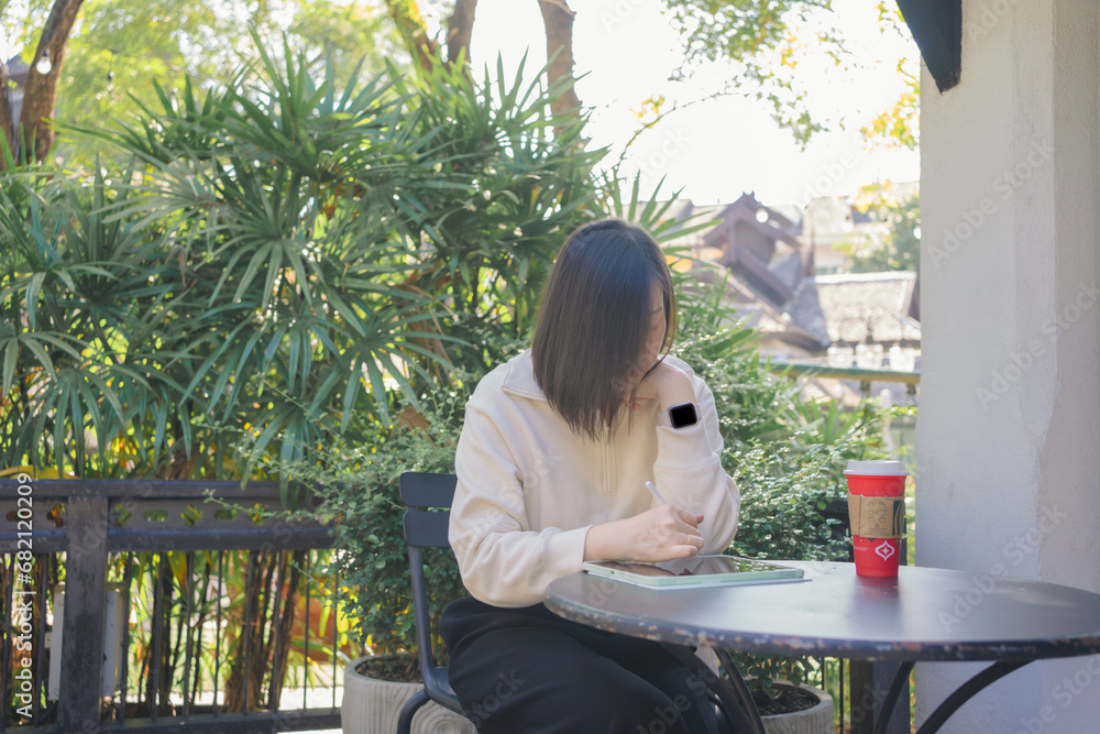 digital nomad concept asian freelancer woman use laptop to work at outdoor of coffeeshop digital nomad concept asian freelancer woman use laptop to work at outdoor of coffeeshop