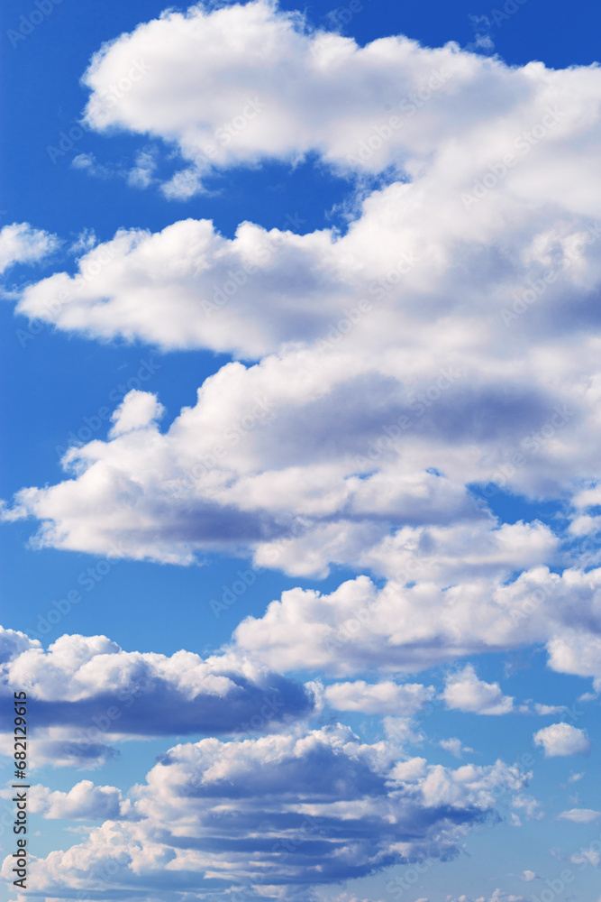 Fototapeta premium Blue sky with white clouds, bright colored cloudscape. Fluffy heaven pattern, aesthetic natural scene. Beautiful Cloudy background, nature environment backdrop, wallpaper, screensaver