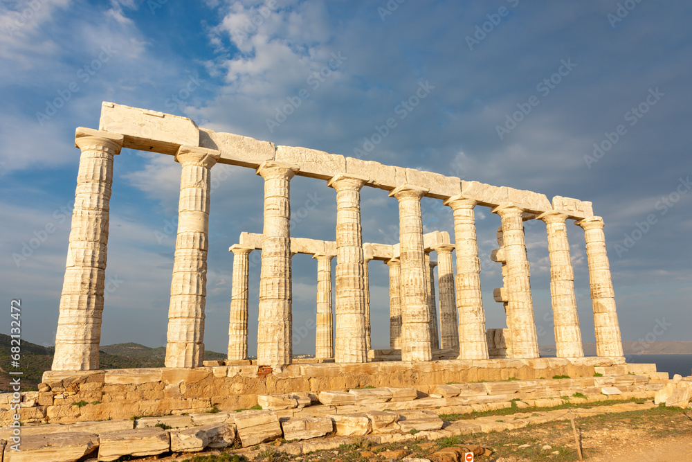 Obraz premium The Temple of Poseidon on Cape Sounion, Attica, Greece - ancient stone temple with Doric columns 