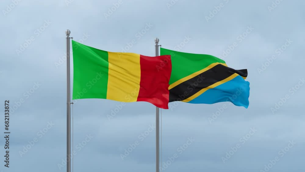 Tanzania and Mali flag waving together on cloudy sky, endless seamless loop, two country cooperation concept Tanzania and Mali flag waving together on cloudy sky, endless seamless loop, two country cooperation concept