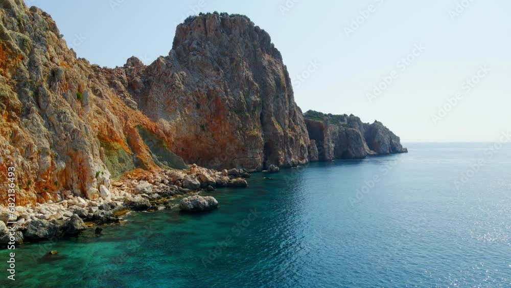 Aerial 4K drone view of Suluada Island in Adrasan Sea, Antalya – Turkey. Video of a turquoise sea, tour boats docked on the island and people swimming on a white sand beach. Aerial 4K drone view of Suluada Island in Adrasan Sea, Antalya – Turkey. Video of a turquoise sea, tour boats docked on the island and people swimming on a white sand beach.