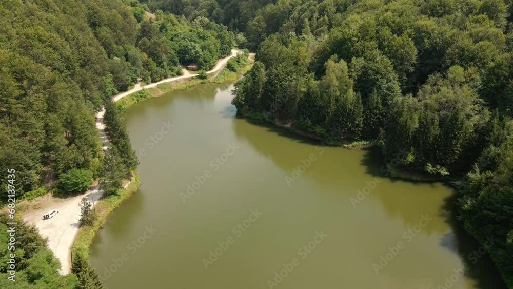 Woods surrounding lake Radalj in Serbia viewed from drone Woods surrounding lake Radalj in Serbia viewed from drone