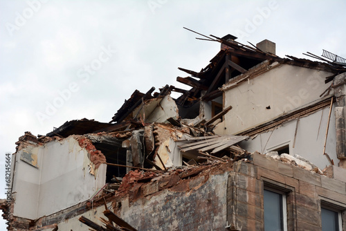 A house destroyed by a missile strike with broken walls and ceiling