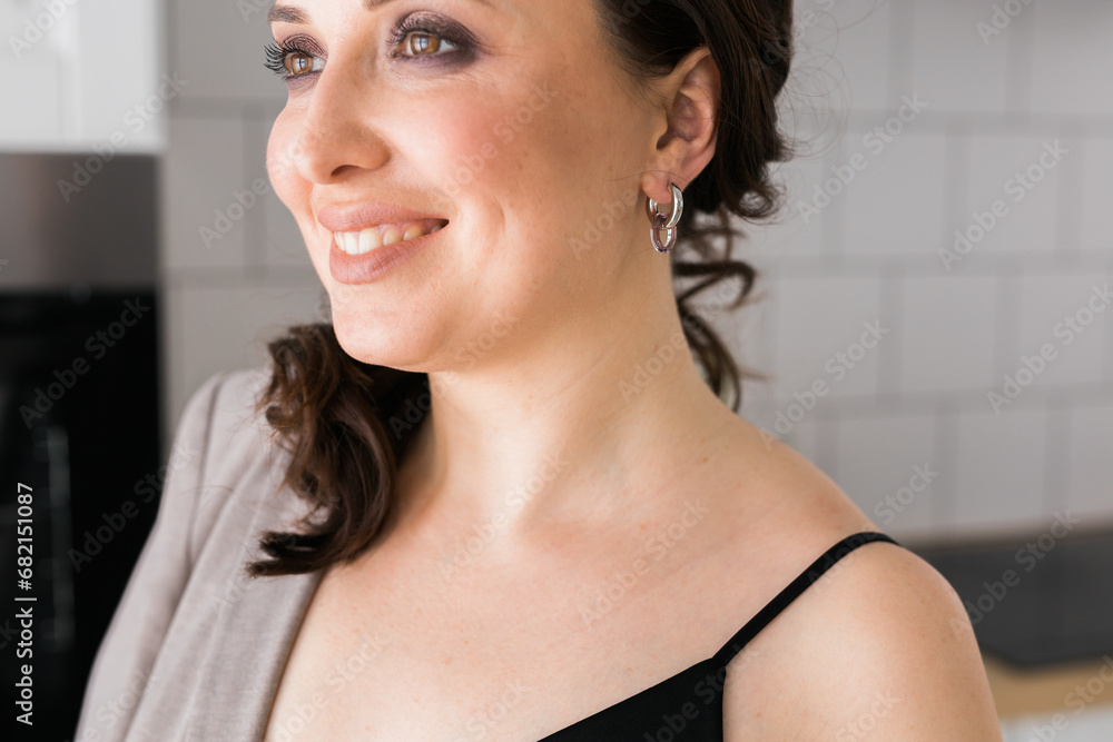 Close-up woman wearing beautiful luxury earrings. Handmade jewellery and accessories. Close-up woman wearing beautiful luxury earrings. Handmade jewellery and accessories.
