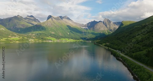 Innfjorden Fjord, Coastal Village With Mountain Ridge In Romsdalen, Norway. Aerial Wide Shot  photo