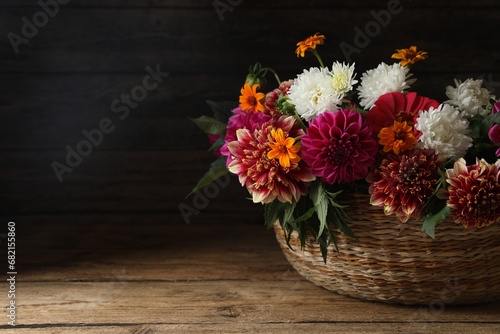 Wallpaper Mural Beautiful wild flowers and leaves in wicker basket on wooden table. Space for text Torontodigital.ca