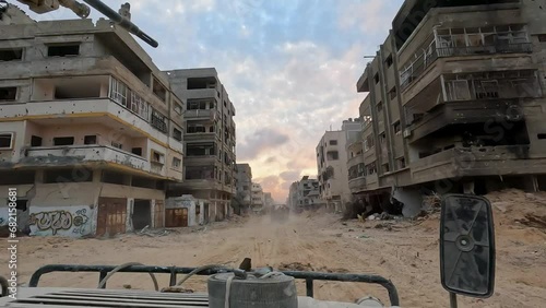 Israeli Humvee forward patrol advance through a built-up area after rocket attacks