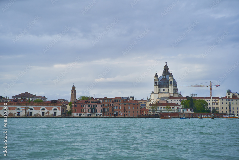 Panorama of Guidecca canal with Church of Saint Mary of Health (Italian: Santa Maria della Salute) building. Venice - 4 May, 2019