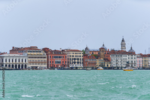 Panorama of Venetian canal waterfront. Colorful houses on the embankment of Guidecca channel. Venice - 5 May, 2019 © hurricanehank