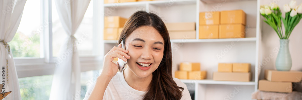 Business owner on the phone talking to a customer, Business owner taking orders from laptop, Packaging and Delivery, Packaging and Shipping. Business owner on the phone talking to a customer, Business owner taking orders from laptop, Packaging and Delivery, Packaging and Shipping.