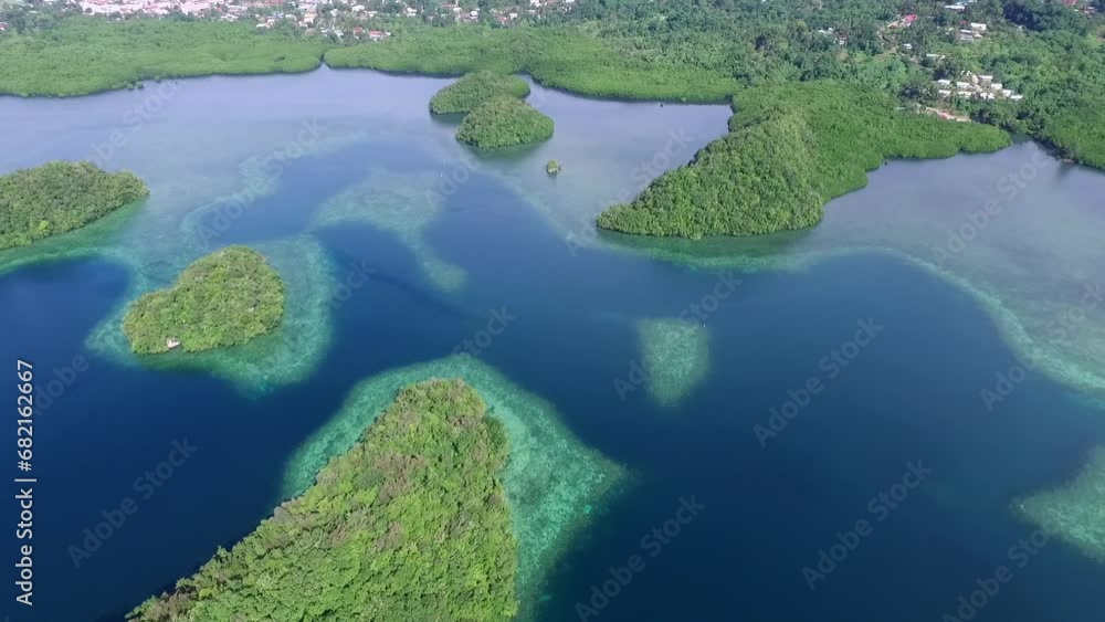 Aerial View Of Koror Island. Many Green Islets. Seascape With Colorful Coral Reefs And Tropical Lagoons. Palau Landscape Aerial View Of Koror Island. Many Green Islets. Seascape With Colorful Coral Reefs And Tropical Lagoons. Palau Landscape