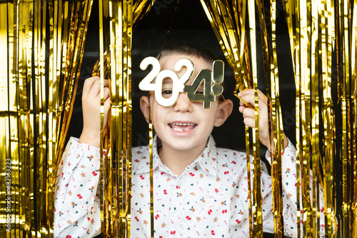 Obraz na płótnie Sweet little boy celebrating New Years Eve. 2024! w salonie