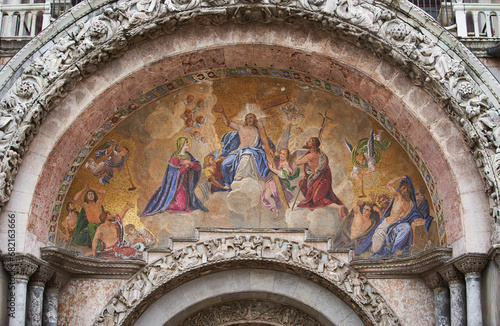 Fresco of Jesus with cross on a Patriarchal Cathedral Basilica of Saint Mark (Italian: Basilica Cattedrale Patriarcale di San Marco). Venice - 5 May, 2019 photo
