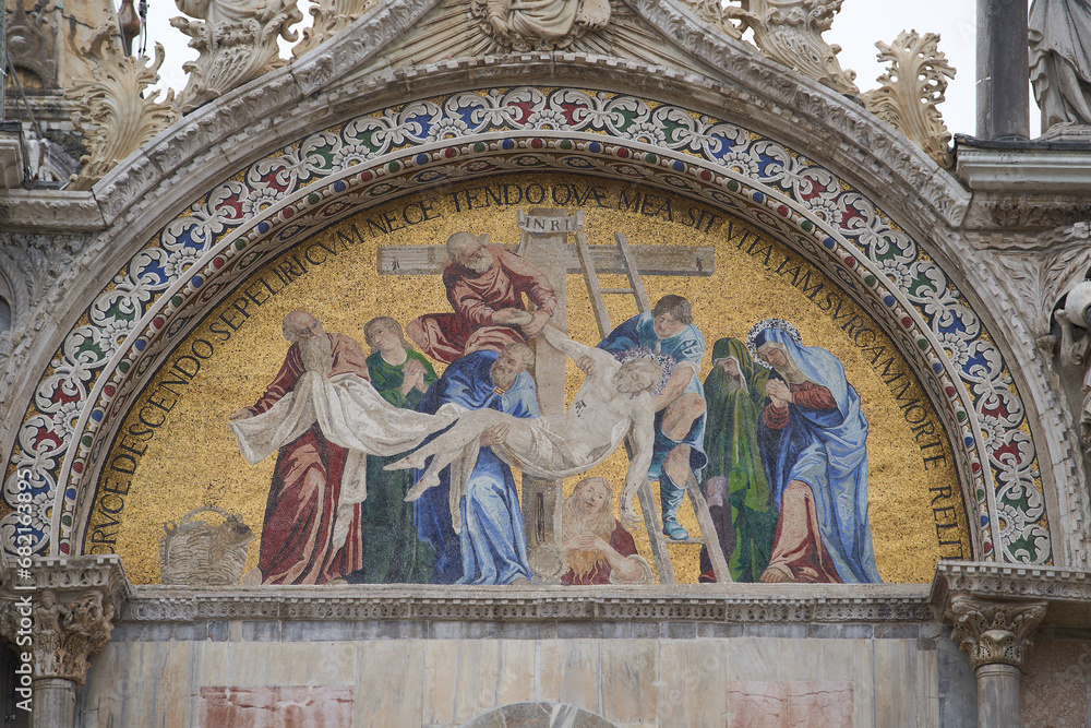 Mosaic of Jesus being taken from a cross on facade of Basilica di San Marco. Venice - 5 May, 2019