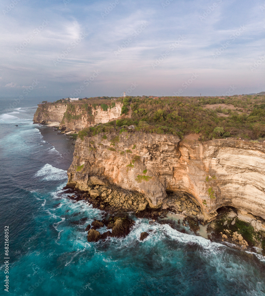 Felice Sunset Point in Bali, Indonesia. Indian Ocean and Rocks in Background Felice Sunset Point in Bali, Indonesia. Indian Ocean and Rocks in Background