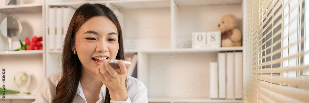 Woman working at home, Attractive woman chatting or talking with colleague on mobile phone at her home, Work for home, Remote conversation or meeting , Stay home, Use a cell phone or smartphone. Woman working at home, Attractive woman chatting or talking with colleague on mobile phone at her home, Work for home, Remote conversation or meeting , Stay home, Use a cell phone or smartphone.
