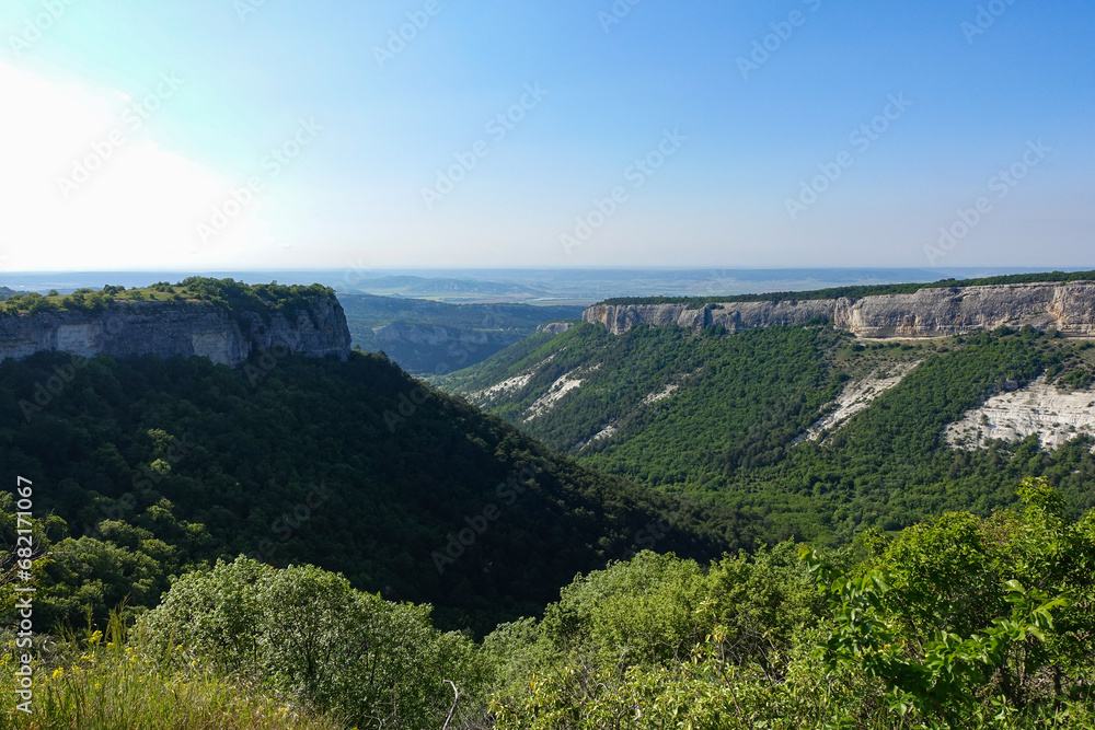 Mangup-Kale cave city, sunny day. Mountain view from the ancient cave town of Mangup-Kale in the Republic of Crimea, Russia. Bakhchisarai.