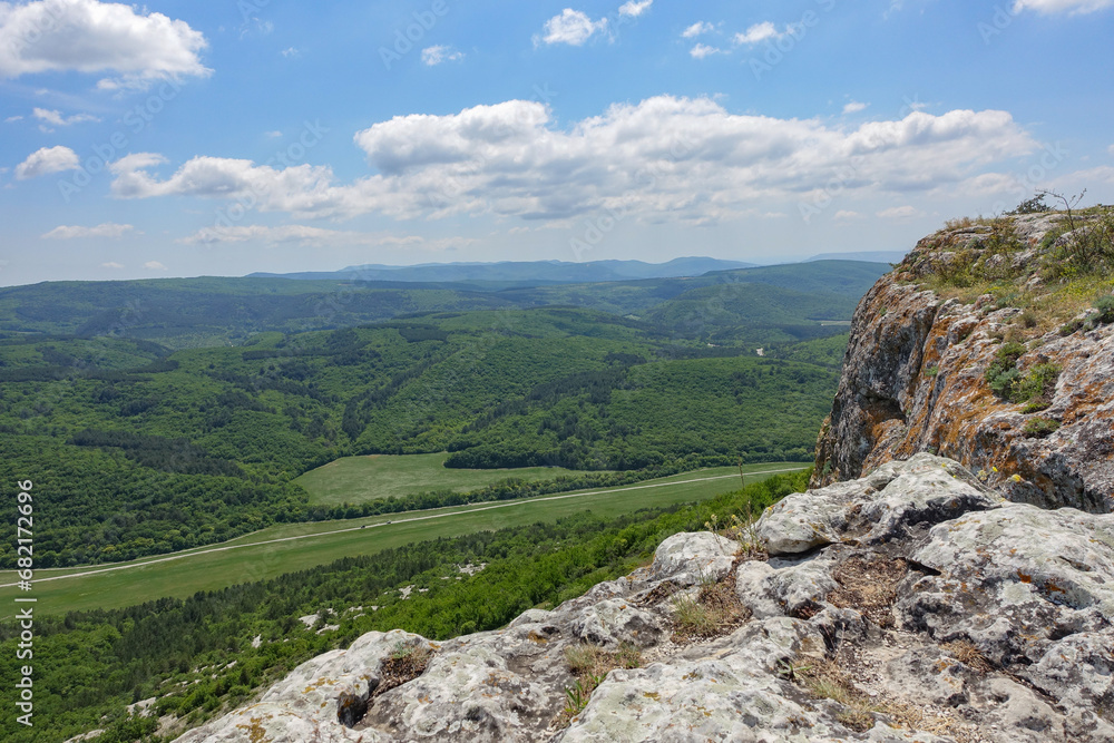 Mangup-Kale cave city, sunny day. Mountain view from the ancient cave town of Mangup-Kale in the Republic of Crimea, Russia. Bakhchisarai. Mangup-Kale cave city, sunny day. Mountain view from the ancient cave town of Mangup-Kale in the Republic of Crimea, Russia. Bakhchisarai.