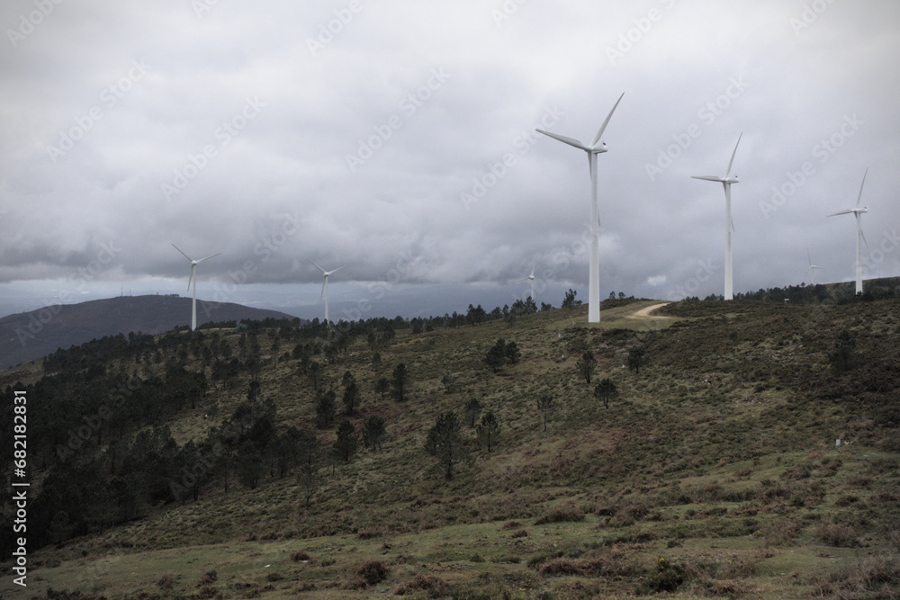 Scattered trees among wind turbines - Wind turbines punctuate the landscape, with scattered trees enhancing the scene in Galicia, shot with the Sony RX100.