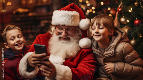 Santa Claus taking a selfie with children. Santa Claus with people taking a photo. Christmas Celebration with Santa Claus.
