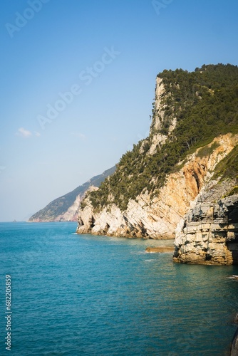 Scenic view of majestic cliffs surrounded by blue waters. Portofino, Italy