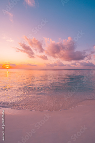 Closeup sea sand beach. Panoramic beach landscape. Inspire calm tropical seascape horizon. Colorful sunset sky clouds tranquil relax sunlight summer sunrise mood. Vacation travel holiday destination © icemanphotos
