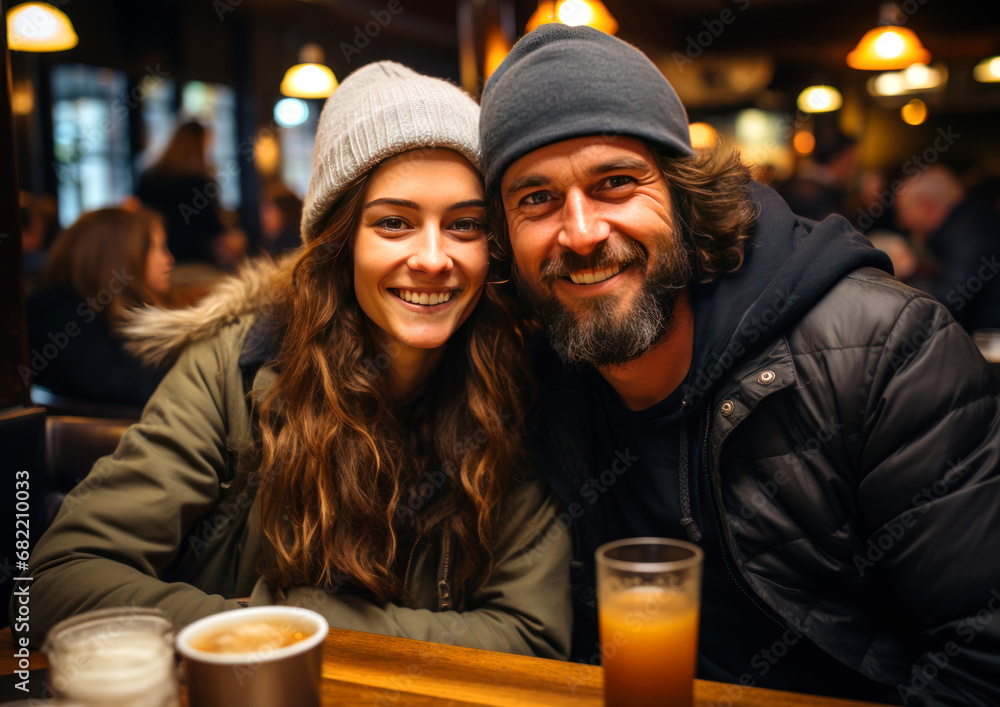 happy laughing couple relaxing in bar, going out on weekend