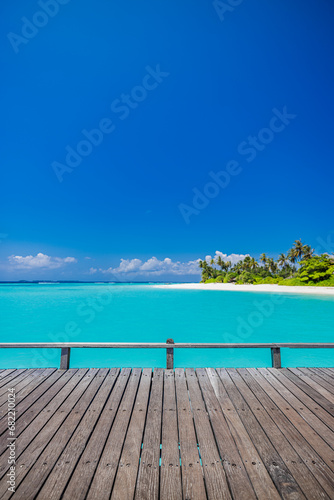 Summer beautiful landscape, nature of tropical beach with wooden platform, sunlight. White sand beach palm trees bright sea water and sunny blue sky. Copy space summer vacation destination concept