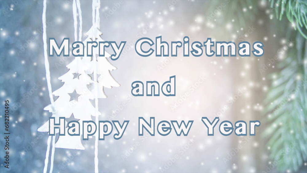 Merry Christmas and Happy New Year words letters design. Small wooden white Christmas trees on string on background white blue surface and green Christmas tree branch. Falling snow snowflakes snowfall