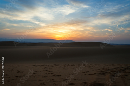 “Sunrise over the desert: a magical moment of tranquility and beauty”