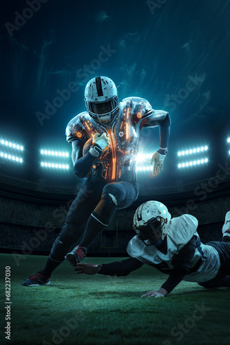 Картината върху платно American football players during game running on grass field stadium with spotlights in futuristic illuminating protective uniform
