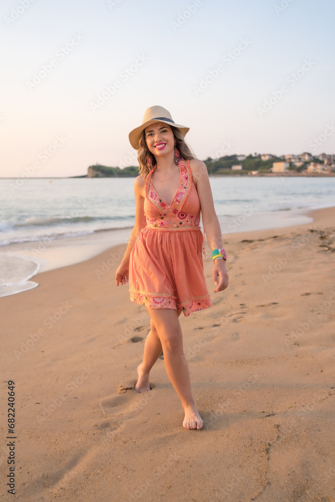 Tourist walking happily along a sandy beach