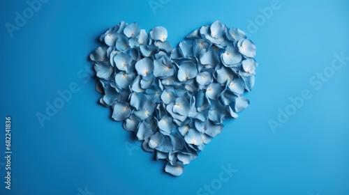  a heart shaped arrangement of blue flowers on a blue background with a place for the text on the left side of the image and the center of the heart is surrounded by smaller blue petals.