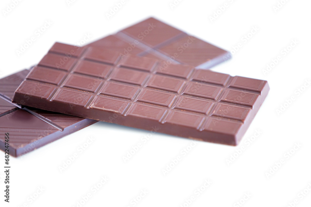 Chocolate bar, studio candy and sugar sweets for delicious temptation, wellness or tasty dessert treat, cacao slab or snack. Unhealthy junk food, product quality and premium cocoa on white background Chocolate bar, studio candy and sugar sweets for delicious temptation, wellness or tasty dessert treat, cacao slab or snack. Unhealthy junk food, product quality and premium cocoa on white background