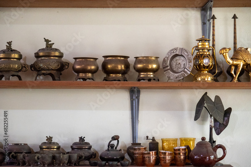 Various decorative iron cups and containers are typical Indonesian decorations