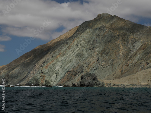 Landscape from the sea of Marguerite island coast over the pacific ocean volcanic rocks in baja california sur, mexico photo