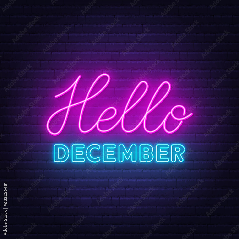 Hello December neon lettering on brick wall background.