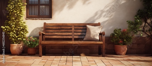 In the corner of the vintage-themed patio, a old wooden bench with its textured brown design stood atop the tile floor, adding a touch of rustic decoration to the outdoor furniture, inviting passersby © 2rogan