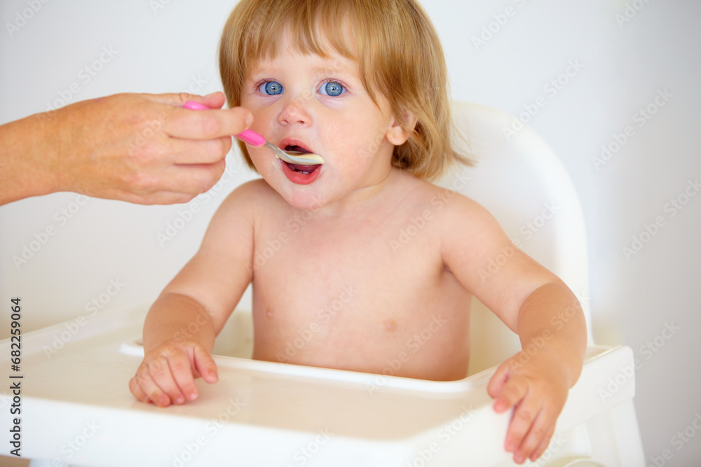 Hand, baby and eating food or portrait for healthy dinner or childhood development, hungry on spoon. Person, feeding chair and kid face for lunch time or nutrition vitamins, breakfast or parent care Hand, baby and eating food or portrait for healthy dinner or childhood development, hungry on spoon. Person, feeding chair and kid face for lunch time or nutrition vitamins, breakfast or parent care
