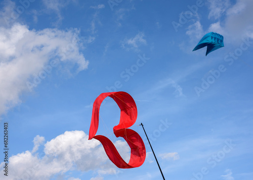 Various kites flying on the blue sky in the kite festival