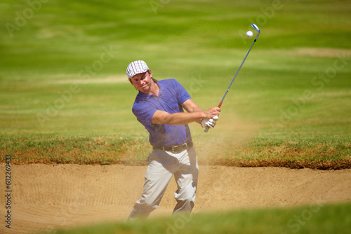 Sports, sand and man on golf course with club for playing game, practice and training for competition. Professional golfer, grass and person swing with golfing driver for winning stroke or score