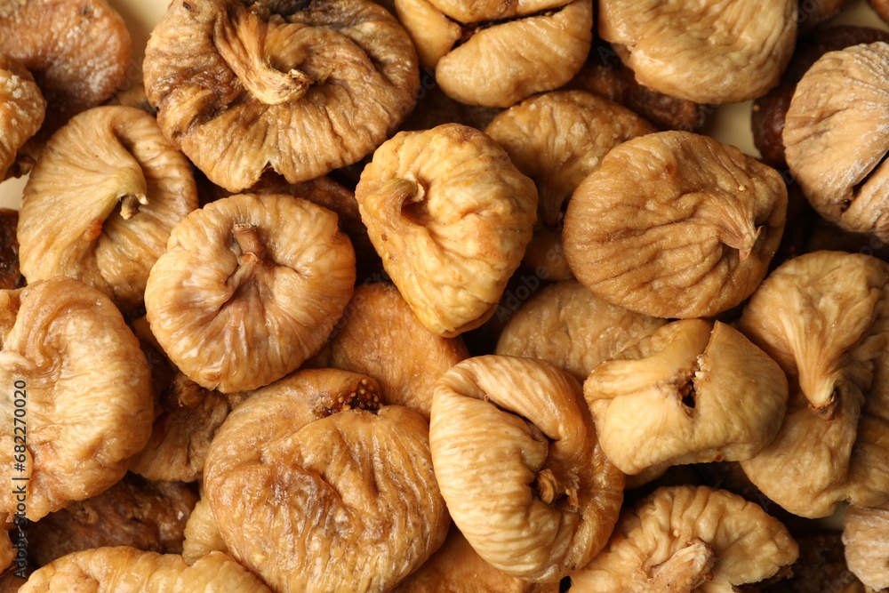Many tasty dried figs as background, top view Many tasty dried figs as background, top view