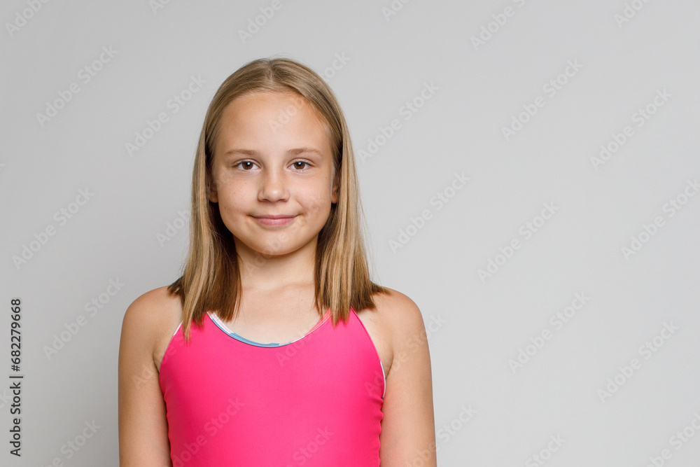 Obraz premium Beautiful kid girl with brown hair and cute smile on white background